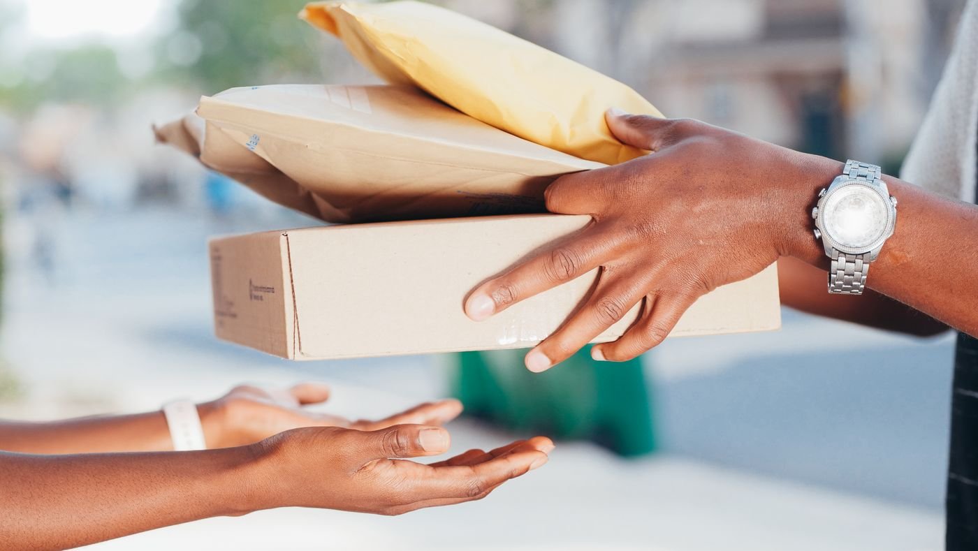 Hands exchanging a donation box